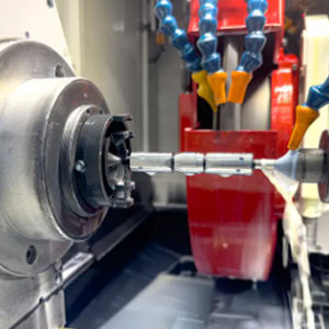 Precision long shaft grinding
