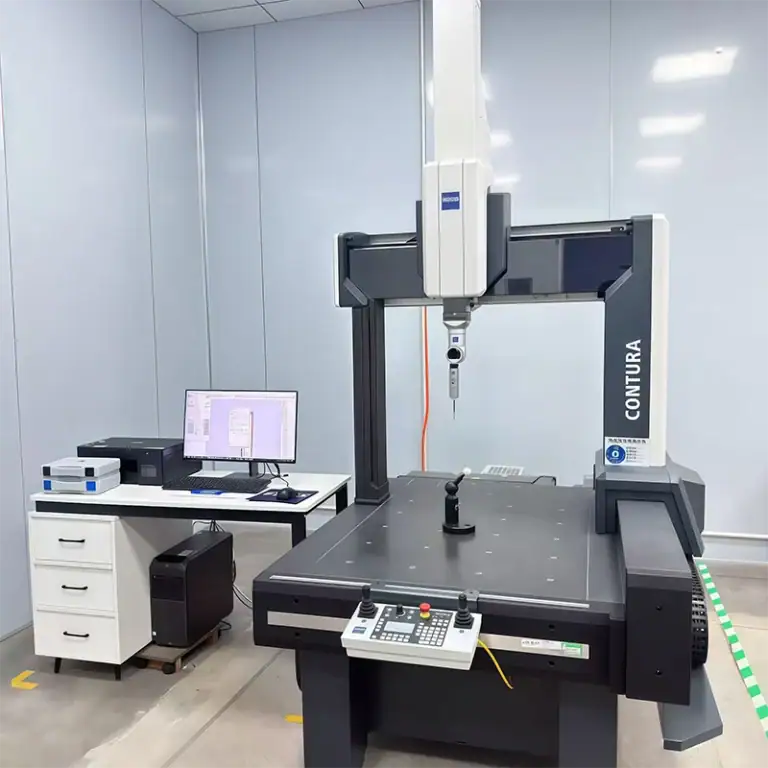 Bridge coordinate measuring machine with a granite table, reference sphere, and inspection workstation