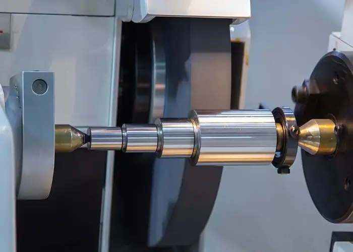 Close-up photo showing working precision grinding machining process on workpiece