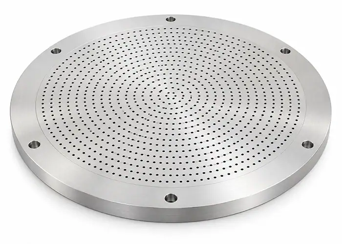 Illustration of a circular semiconductor shower head faceplate with gas distribution holes and mounting holes