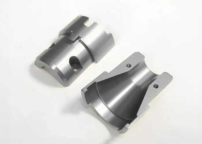 Two precision custom aluminum housing workpieces manufactured by CNC machining